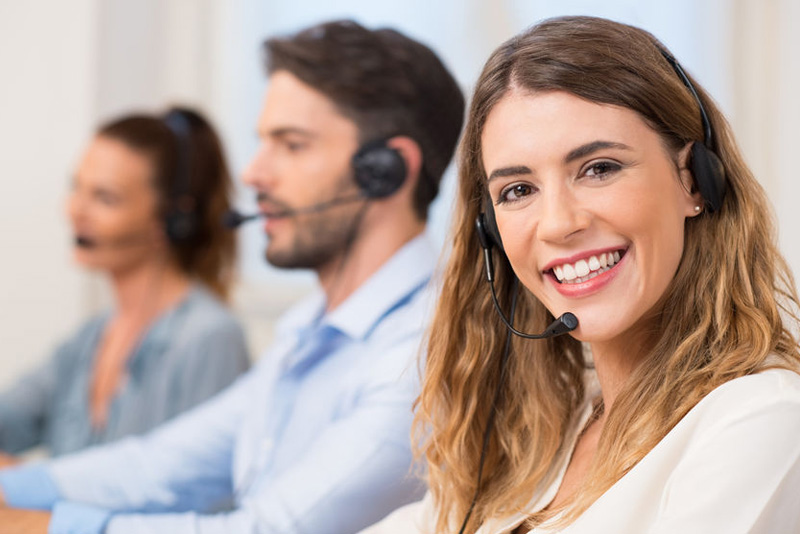 woman-with-headset-smiling-call-centre